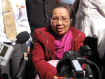 Nguyen Thi Hong speaks to throngs of reporters outside court
